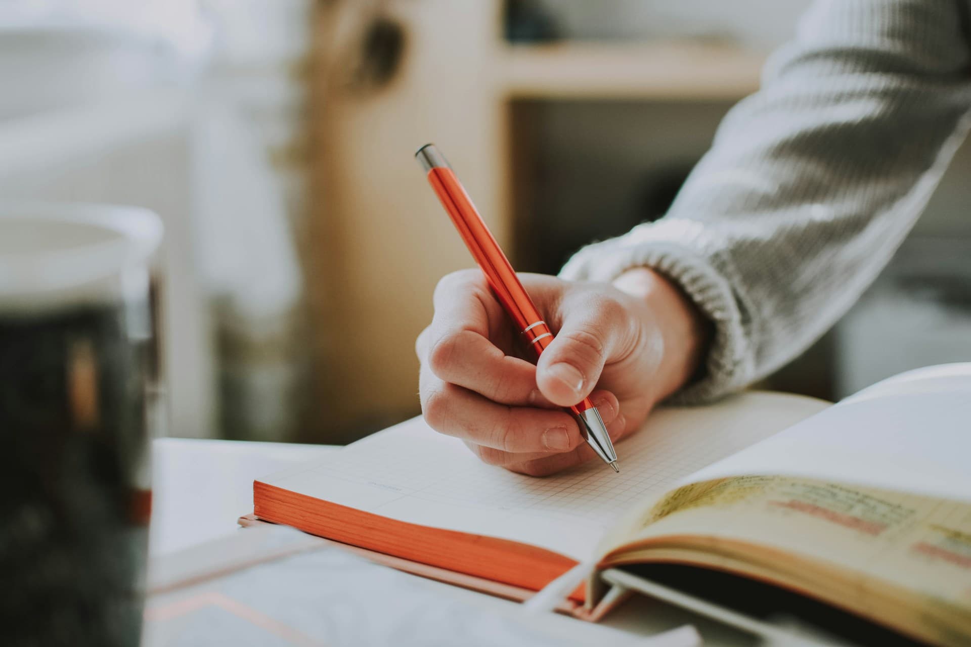 Writer working on a manuscript at a desk